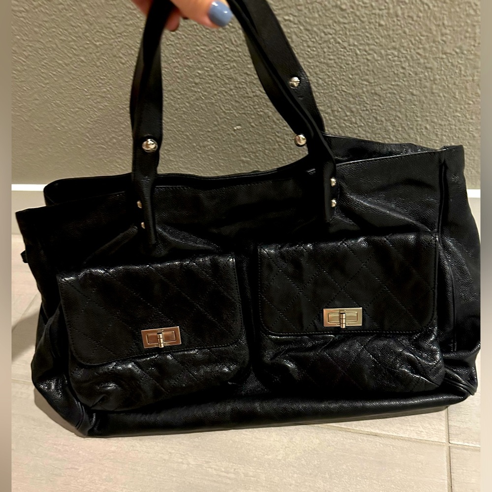 Authentic Chanel Black Glaced Leather with Silver Tone hardware.